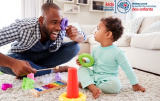 Father playing with his toddler