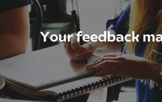 Your feedback matters on a photo were someone writes on a notebook