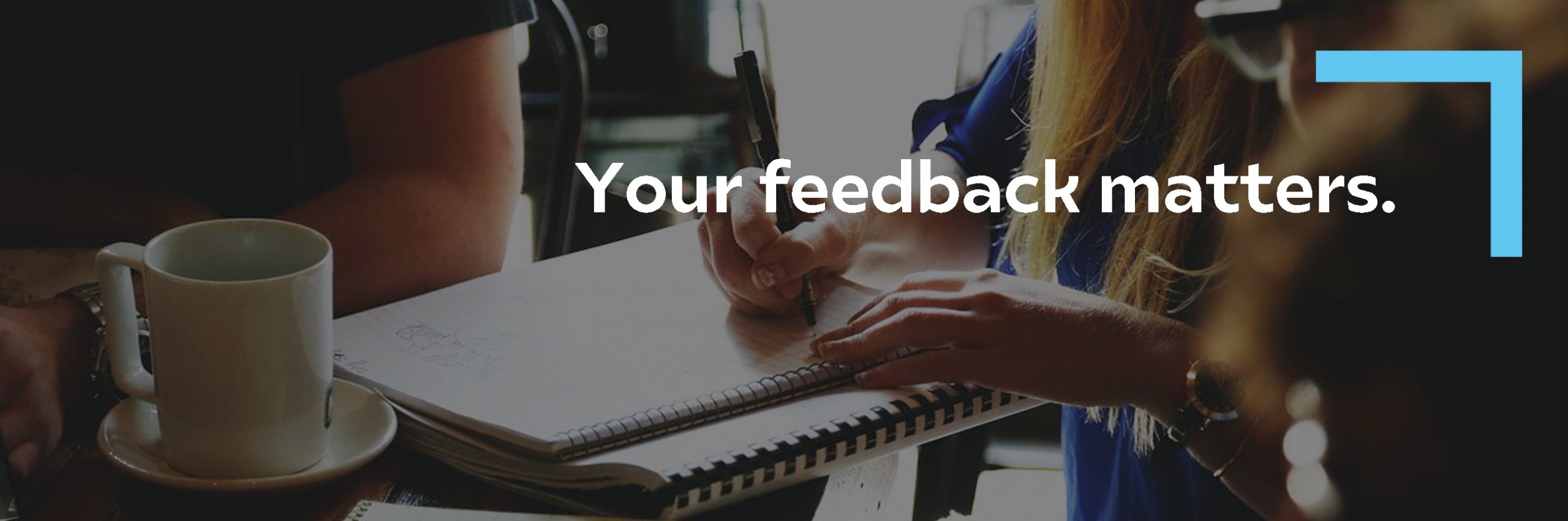 Your feedback matters on a photo were someone writes on a notebook