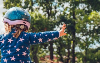 Child rides a horse for therapeutic riding