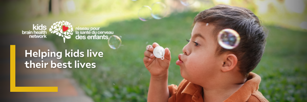 A boy with Down Syndrome is blowing bubbles overlaid by KBHN’s logo and text that says, “Helping kids live their best lives”