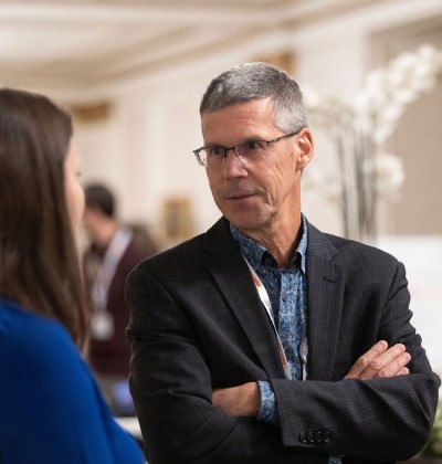 Dr. James Reynolds speaks to one of the attendees at the Annual KBHN Conference 2023.