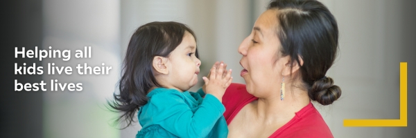 A mother in a red shirt lovingly holds her toddler, who touches her face. Text on the left reads, "Helping all kids live their best lives."